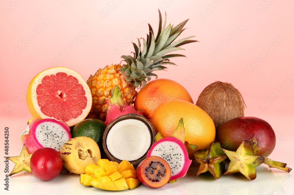 Composition of exotic fruits on red background Composition of exotic fruits on red background