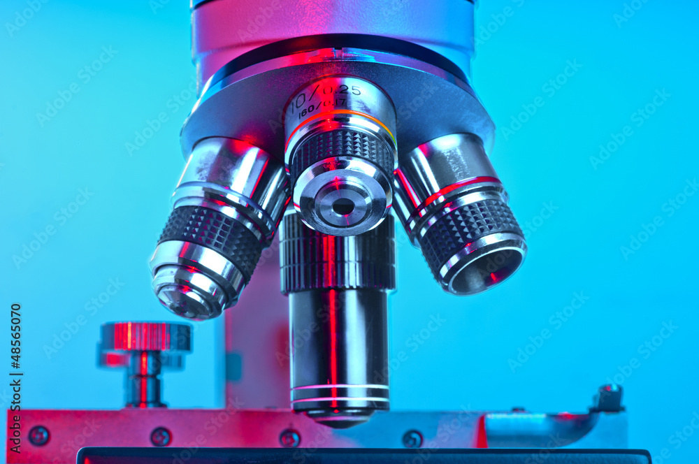 Microscope lenses lit in red and blue Stock Photo Adobe Stock