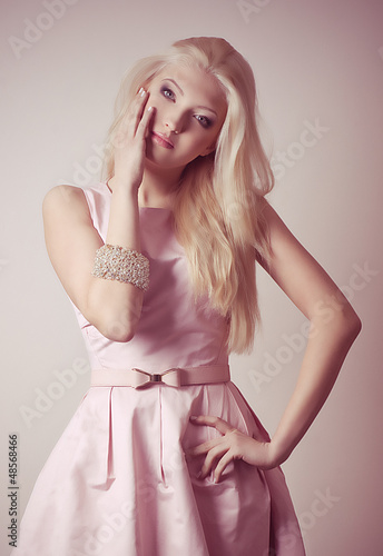 Young girl in pink dress on background. © Forewer