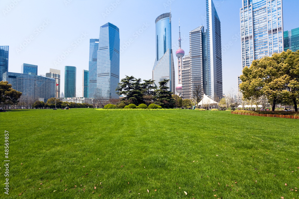 Obraz premium city park with modern building background in shanghai