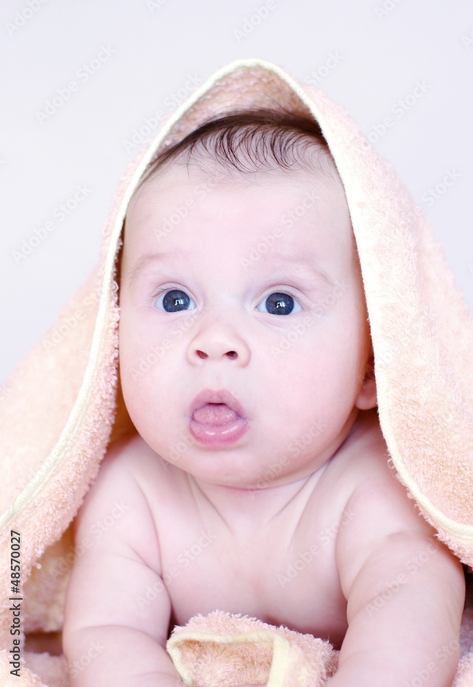 Portrait of the four-months kid in a towel Portrait of the four-months kid in a towel