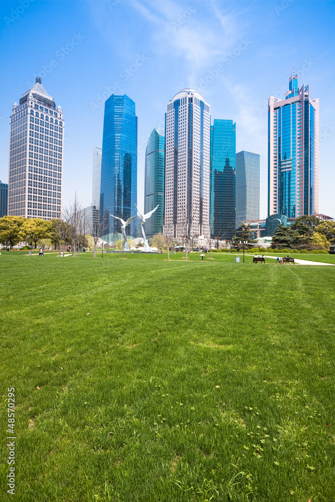 Naklejka premium city park with modern building background in shanghai