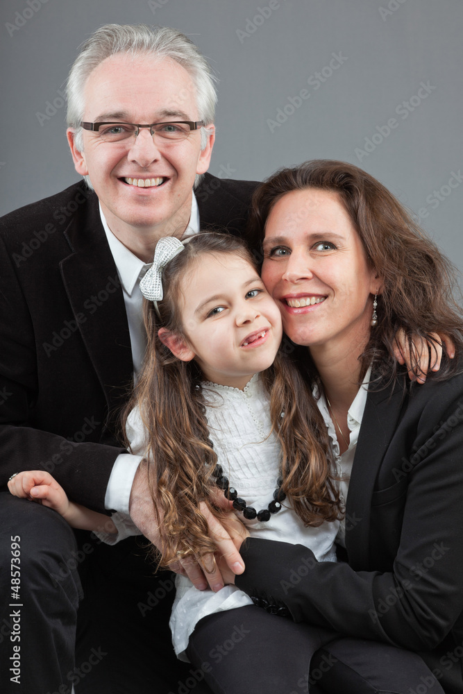 Happy family with father, mother and daughter. Studio shot. Happy family with father, mother and daughter. Studio shot.