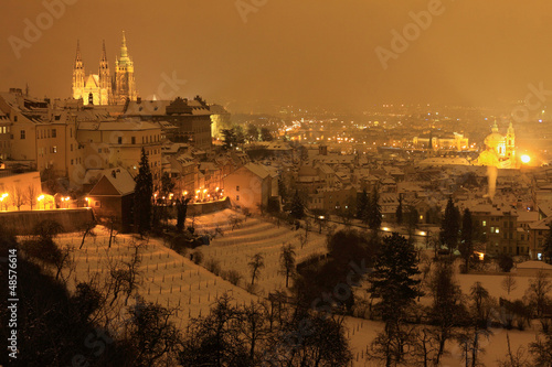 Night snowy winter Prague with gothic Castle  Czech Republic