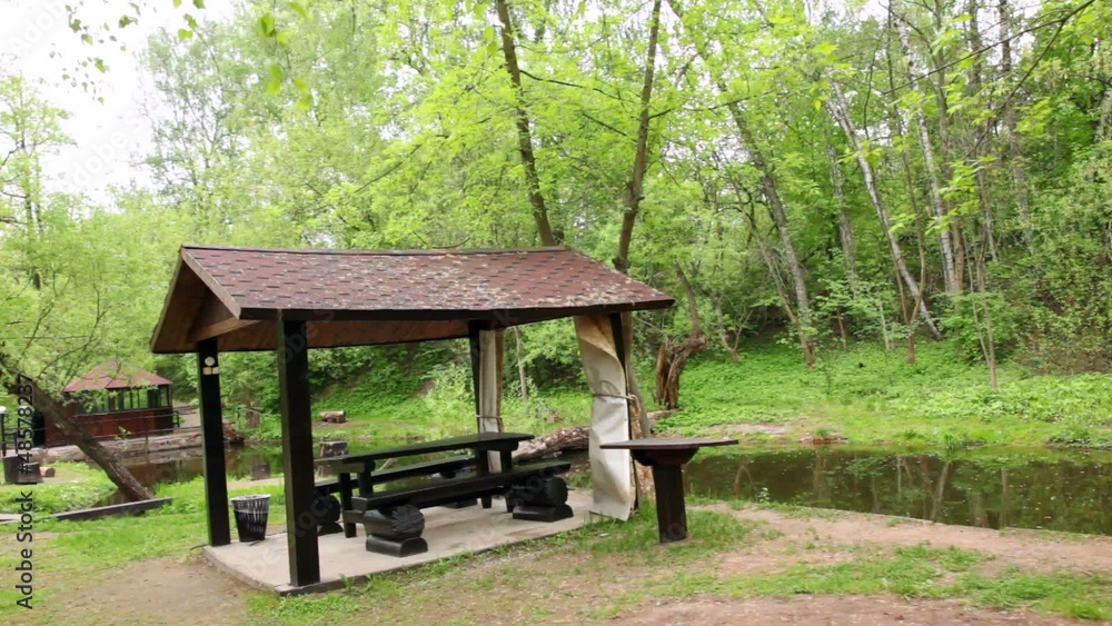 Three summerhouses ashore of small pond Three summerhouses ashore of small pond
