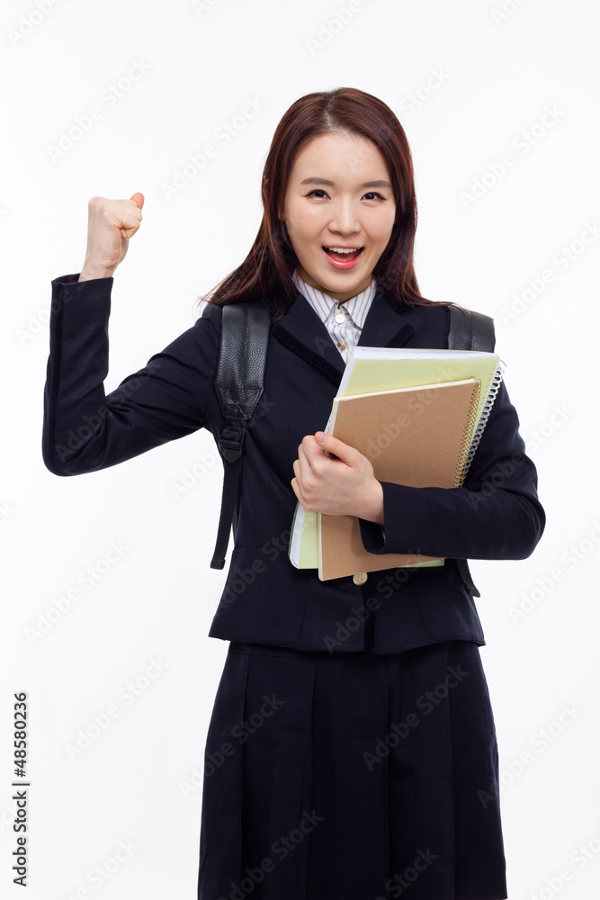 Young pretty Asian student showing fist Young pretty Asian student showing fist