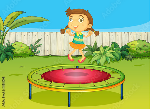 a girl playing on trampoline