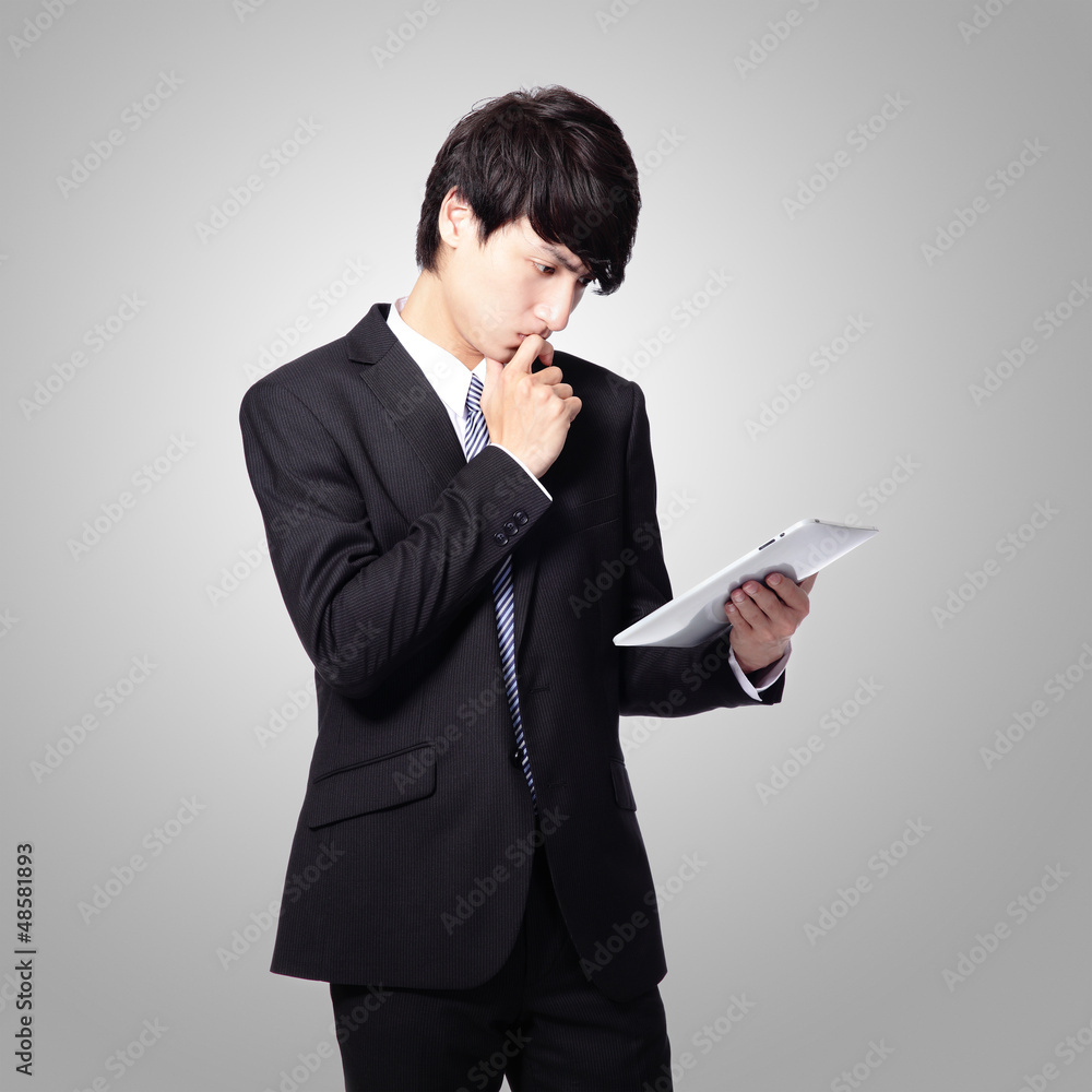 business man reading news on tablet pad business man reading news on tablet pad