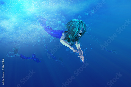 Beautiful mermaid swimming