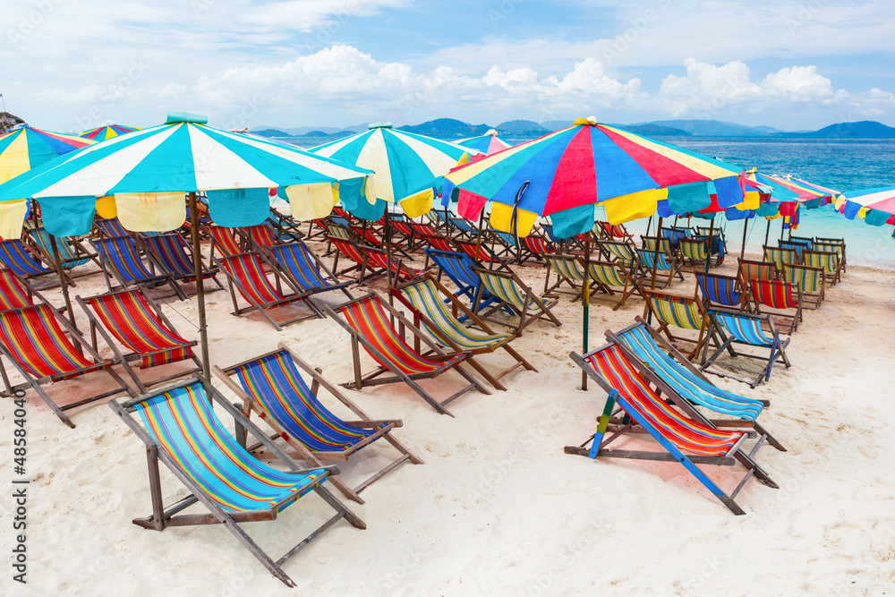 Beach chair and umbrellas on the beach - Kay Island, Thailand