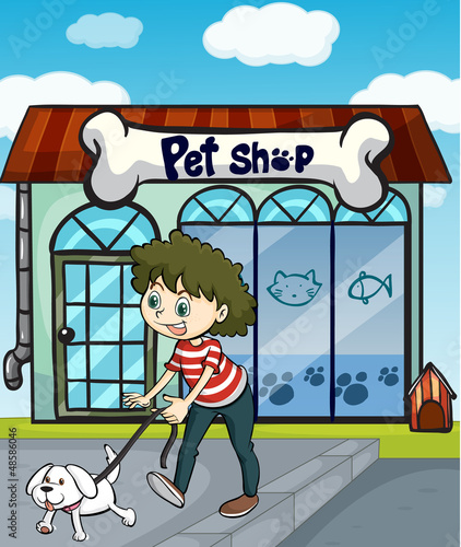 A smiling girl with dog and a pet shop