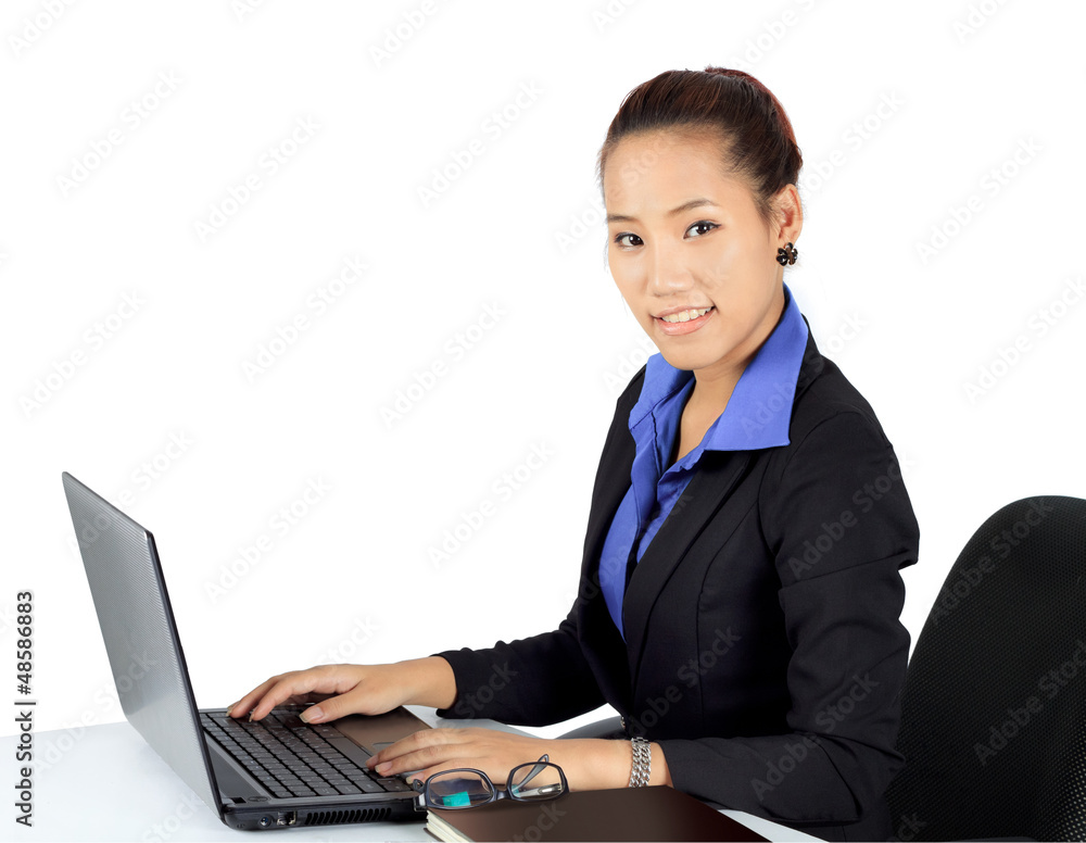 Isolated young business woman working on a desk. Isolated young business woman working on a desk.