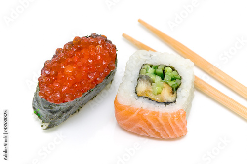 sushi with red caviar and roll "yin-yang" on a white background