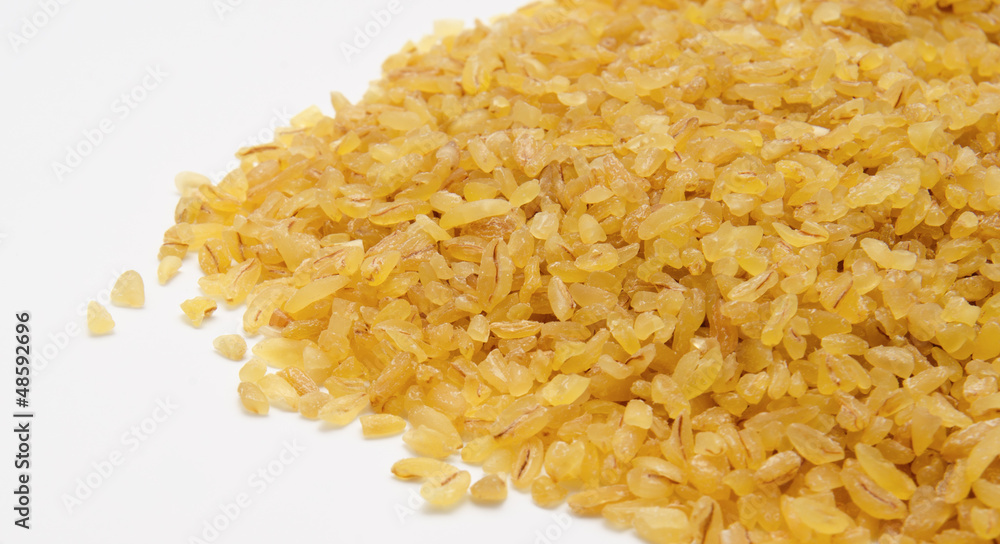 Heap of bulgur wheat groats isolated Heap of bulgur wheat groats isolated