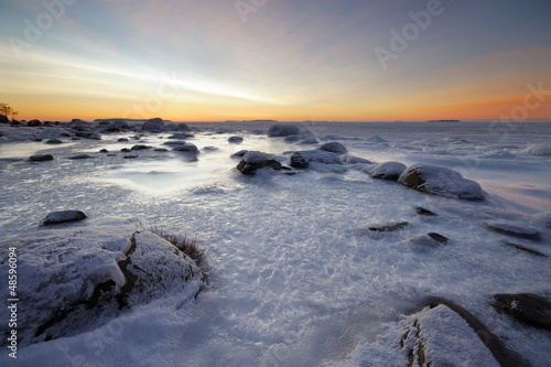 Icy beach in winter morning landscape