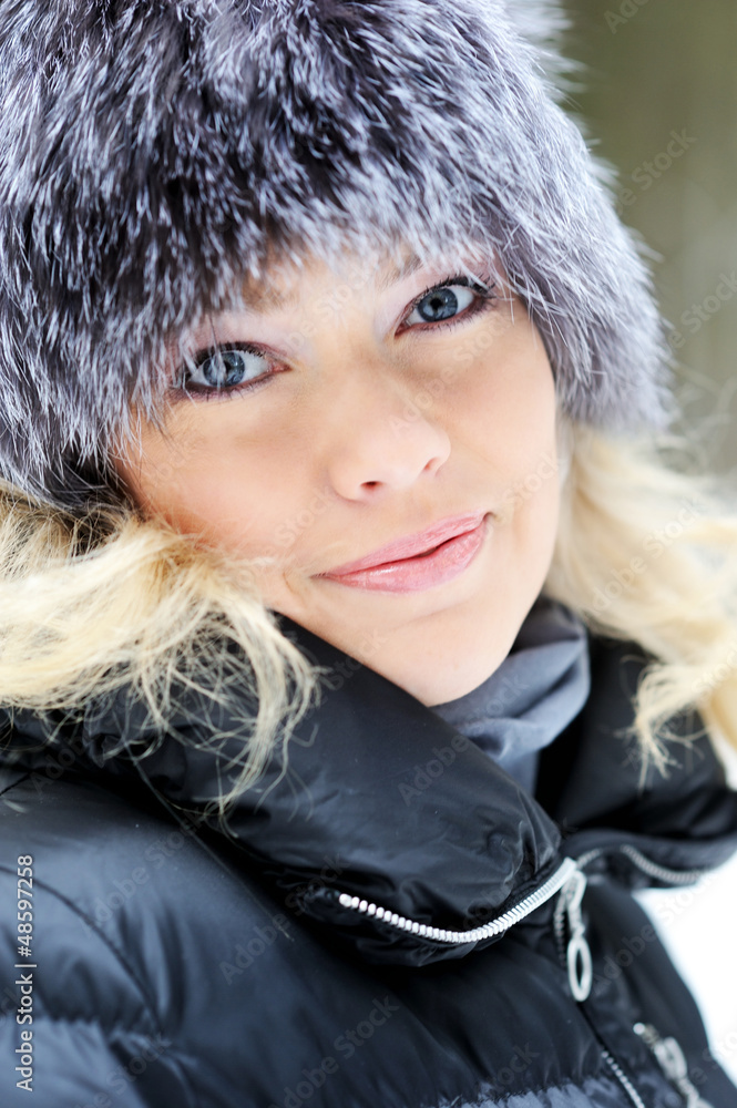 Closeup portrait of young pretty woman in winter outfit outdoors Closeup portrait of young pretty woman in winter outfit outdoors