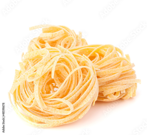 Italian pasta tagliatelle nest isolated on white background