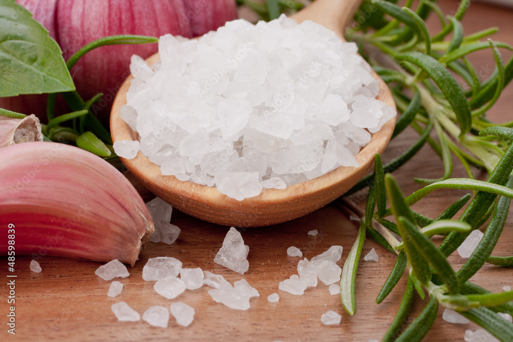 Fresh herbs and salt spoon