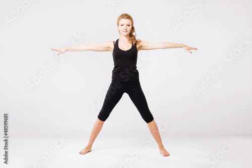 Sporty woman doing stretching exercise