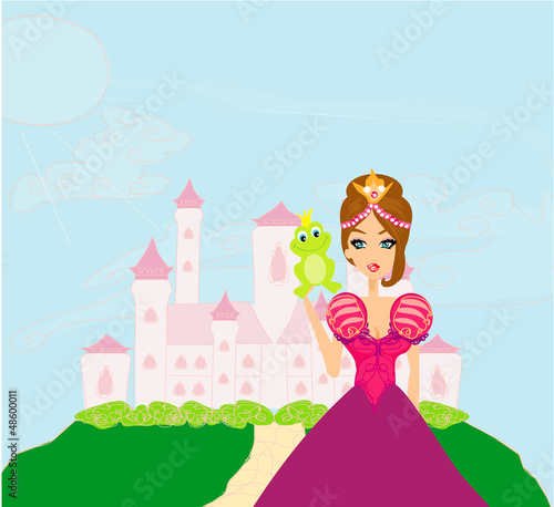 Beautiful young princess holding a big green frog