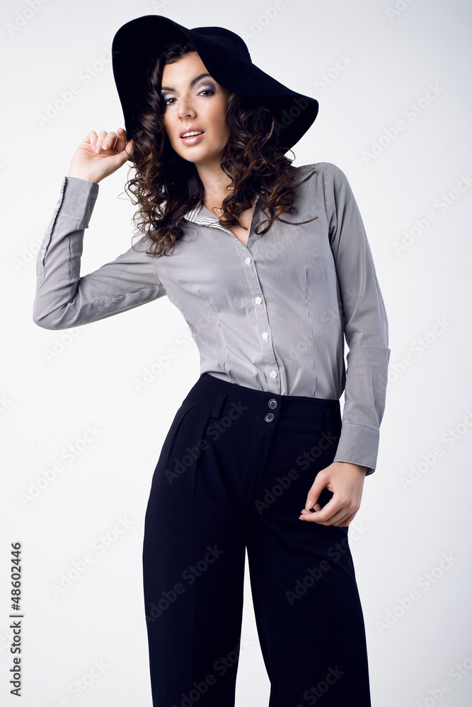 Beautiful young woman wearing black hat, stripes shirt Beautiful young woman wearing black hat, stripes shirt