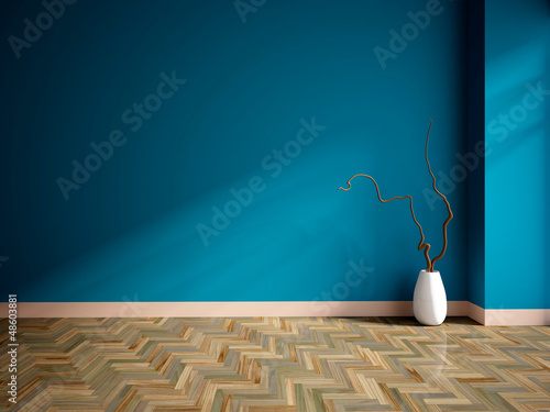 empty interior with a blue wall and vase