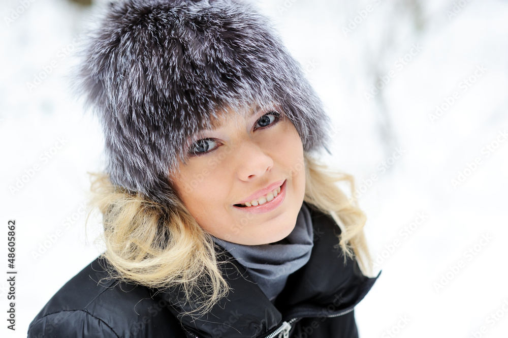 Closeup portrait of young pretty woman in winter outfit outdoors Closeup portrait of young pretty woman in winter outfit outdoors