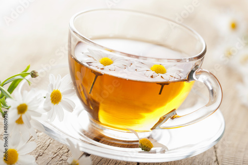 cup of herbal tea with chamomile flowers
