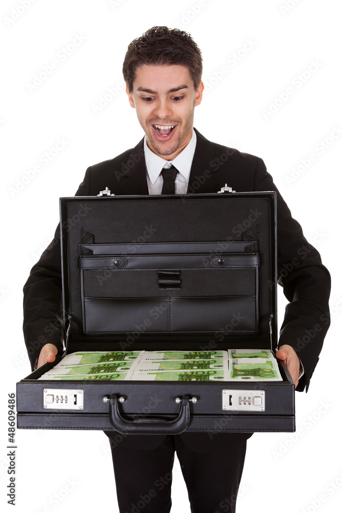 Businessman with suitcase full of cash Businessman with suitcase full of cash