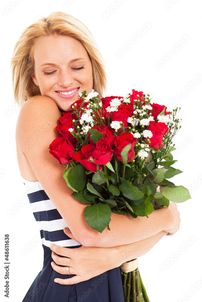 pretty woman hugging bunch of red roses