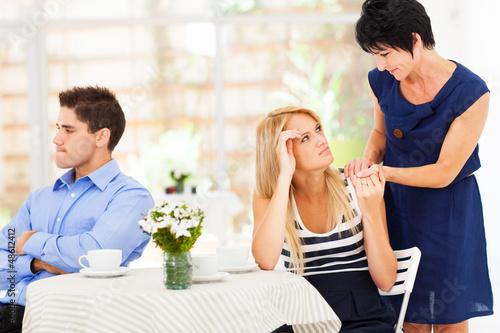 caring mother standing by her daughter has marriage problem photo