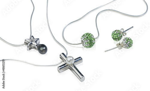 Silver Cross and diamond jewelry isolated on white