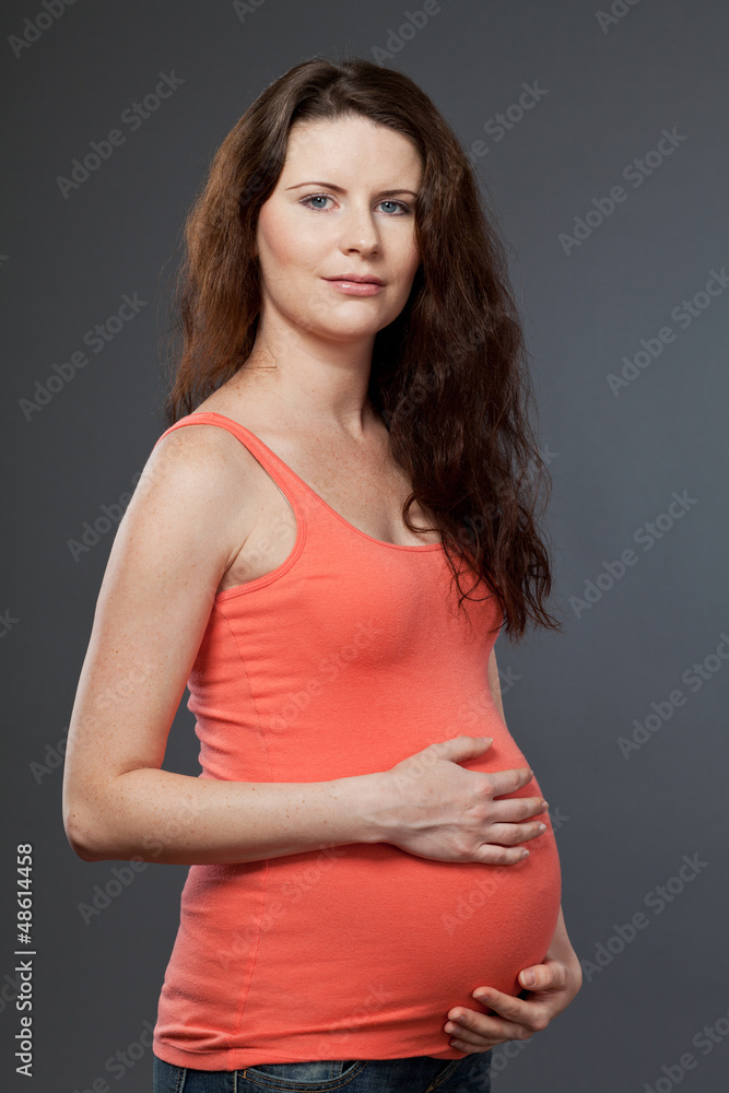Young expecting mother with long dark hair. Young expecting mother with long dark hair.