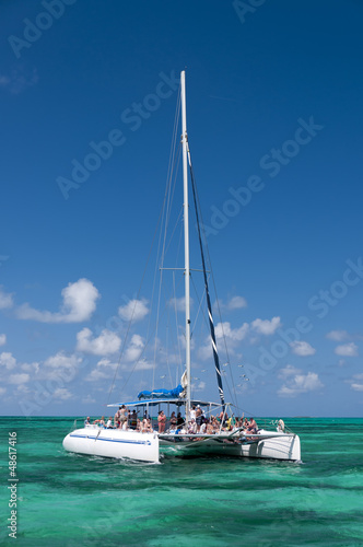 White catamaran on turquoise ocean