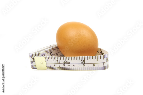 measuring tape and brown egg