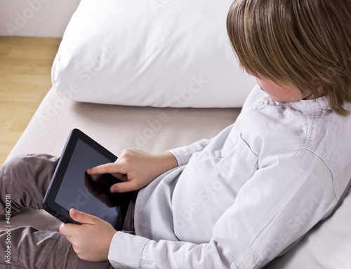 Kid holding digital tablet