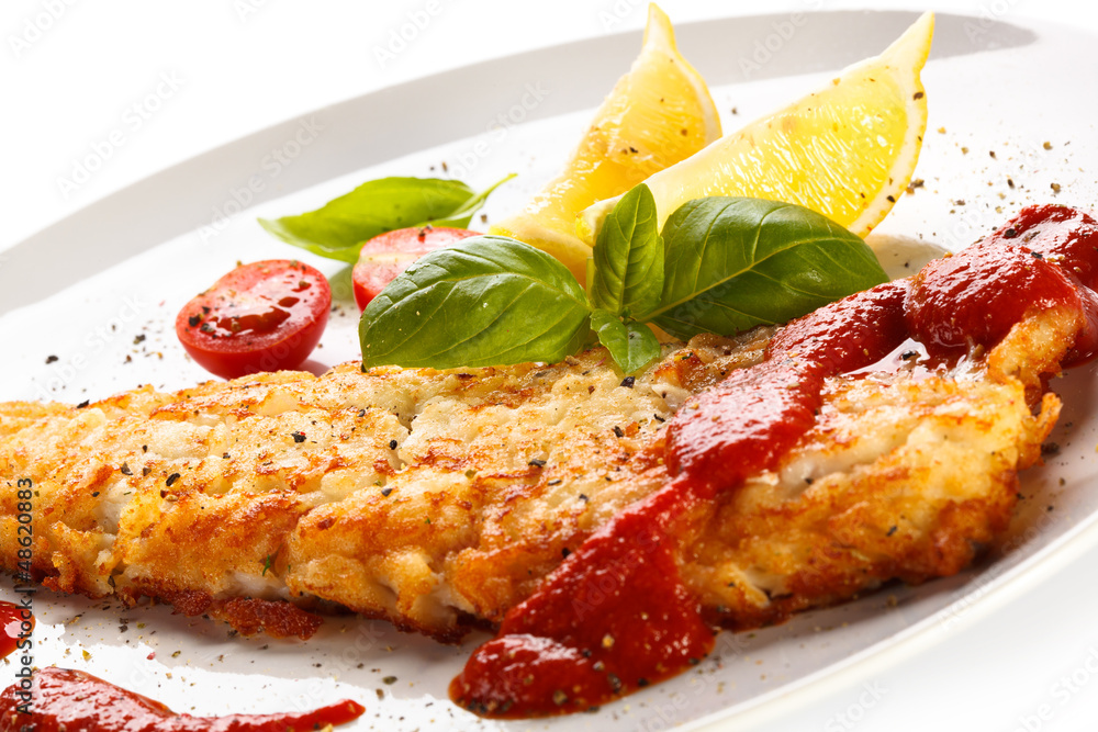 Fish dish - fried fish fillet with vegetables Fish dish - fried fish fillet with vegetables