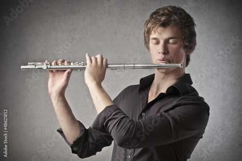 Obraz na plátně boy playing flute