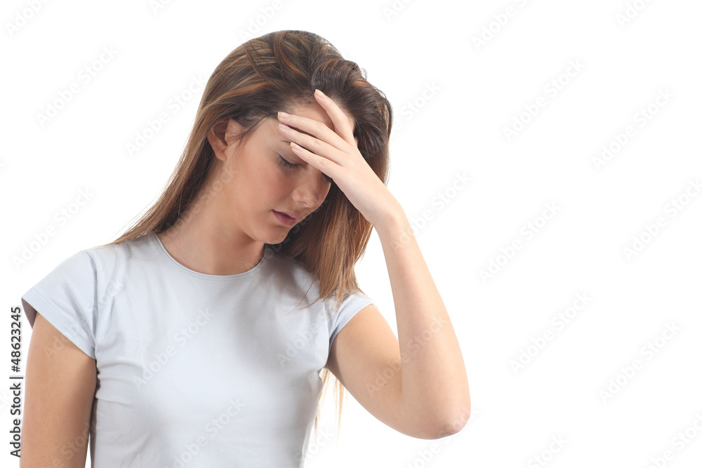 Woman with a headache and her hand in forehead Woman with a headache and her hand in forehead