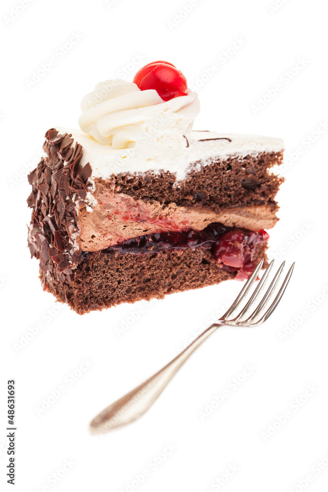 Ein Stück Schwarzwälderkirschtorte mit Gabel davor Ein Stück Schwarzwälderkirschtorte mit Gabel davor