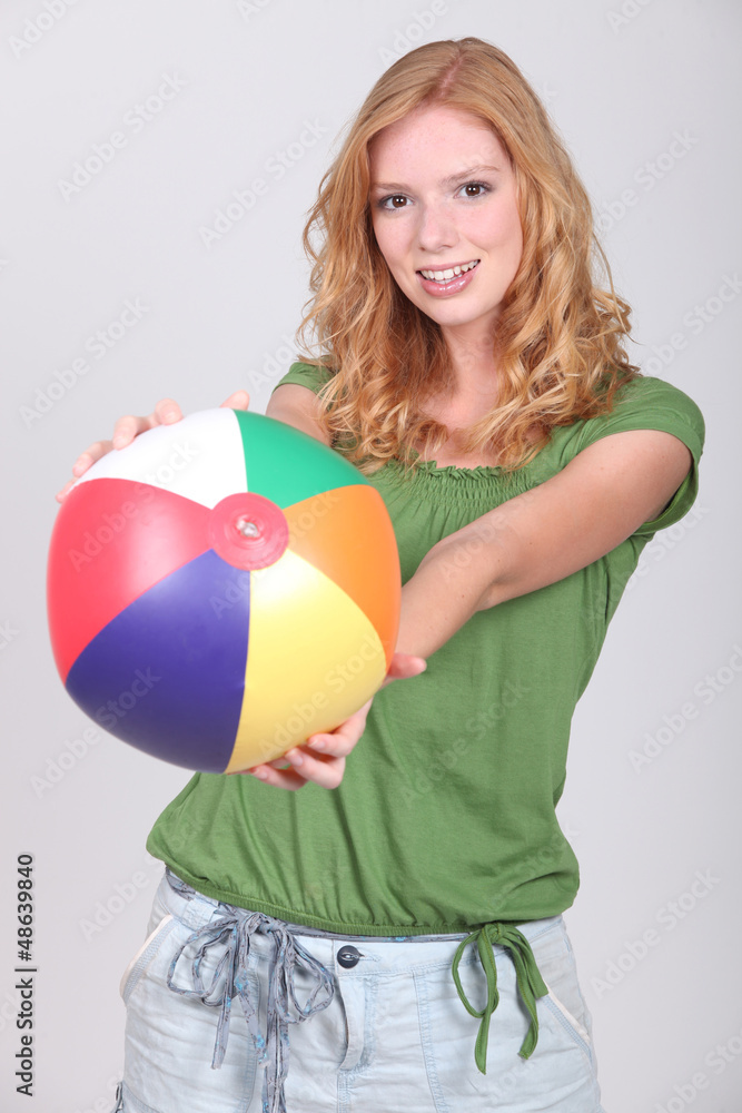 Teenage girl with inflatable beach ball Teenage girl with inflatable beach ball