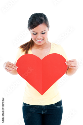 Cute Young Woman Holding Heart Shape Sign