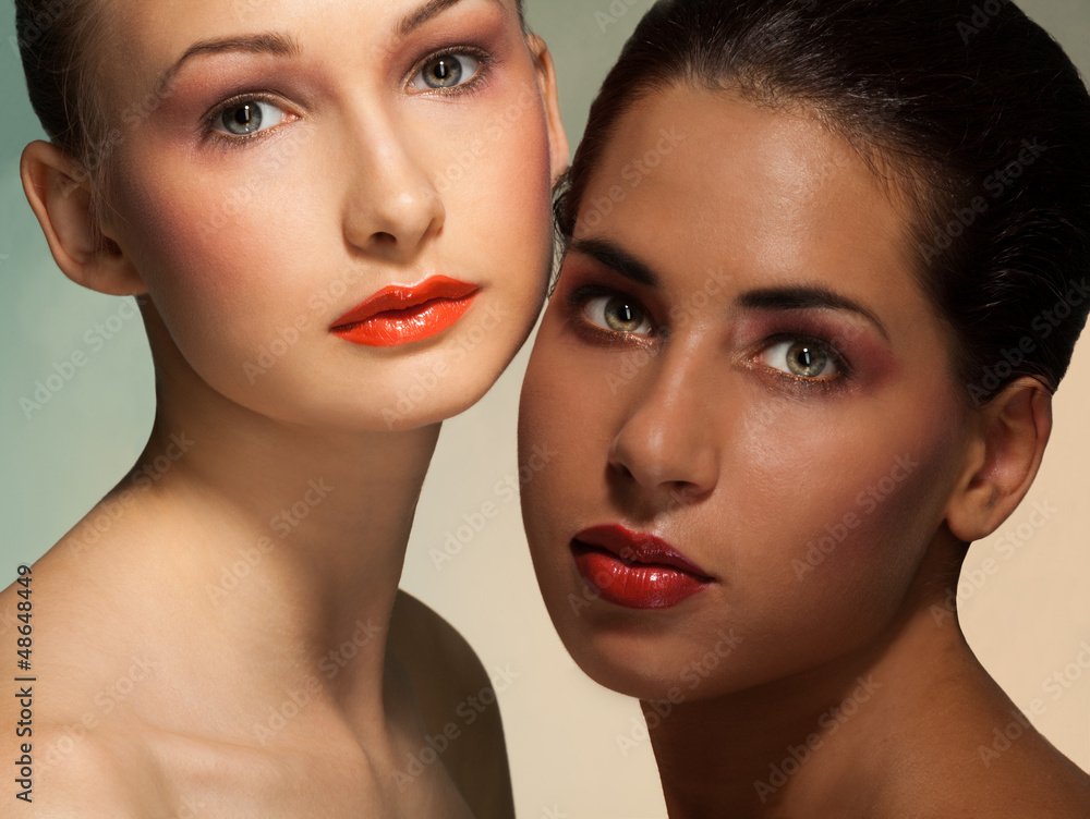 Blond and Latino brunette women portrait Blond and Latino brunette women portrait