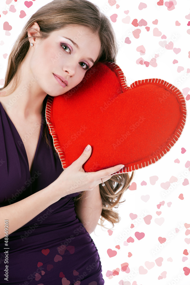 Valentine's Day. Beautiful smiling woman with heart in his hands Valentine's Day. Beautiful smiling woman with heart in his hands