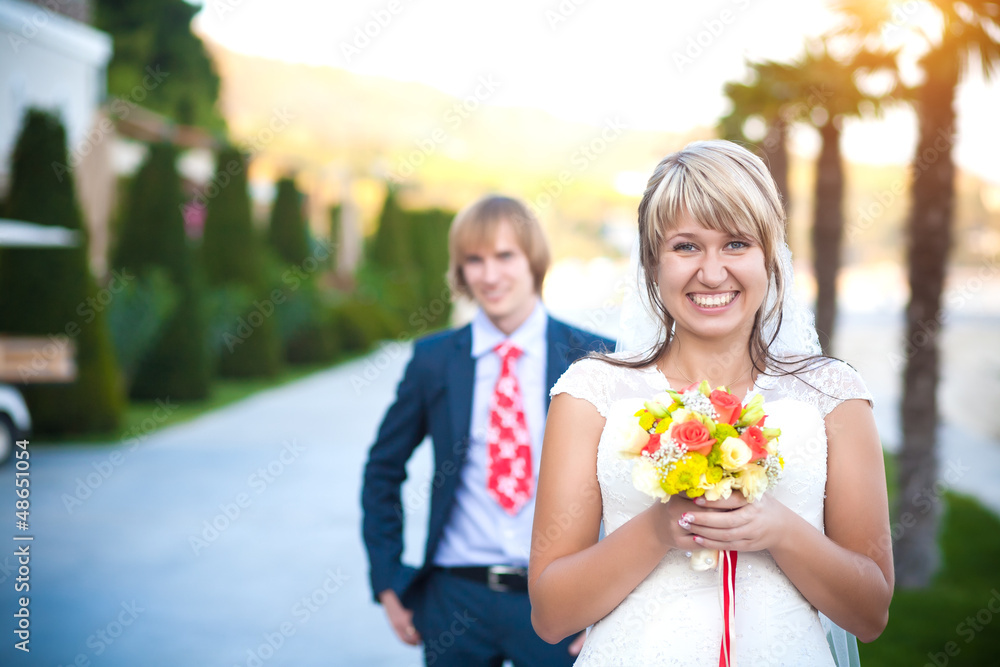 happy couple in a sunny tropical park happy couple in a sunny tropical park