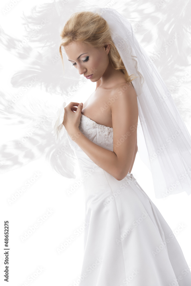 pretty blonde bride with hand on the breast
