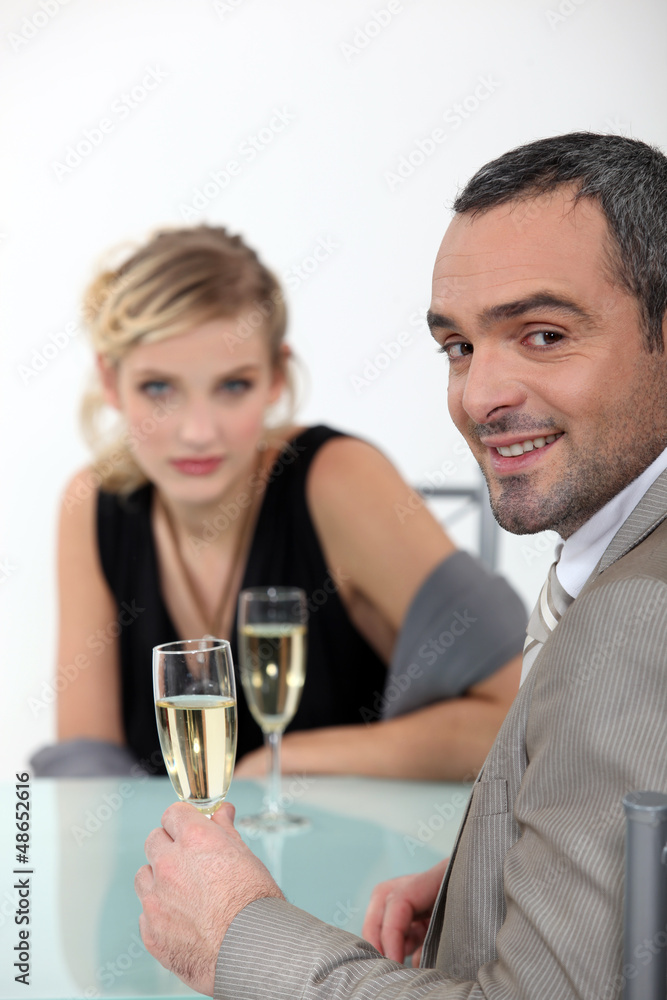 Successful couple toasting with champagne Successful couple toasting with champagne