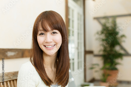 Beautiful young woman relaxing in the room Free Download Beautiful young woman relaxing in the room - GFXLoad
