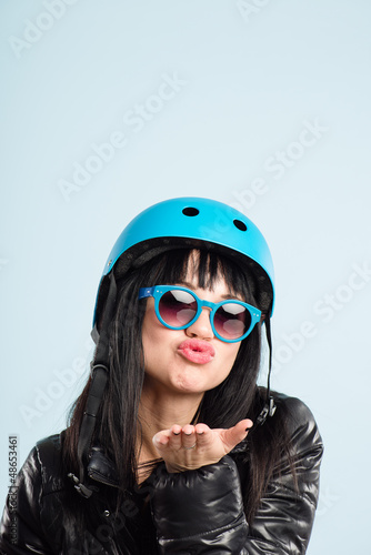 funny woman wearing cycling helmet portrait real people high def