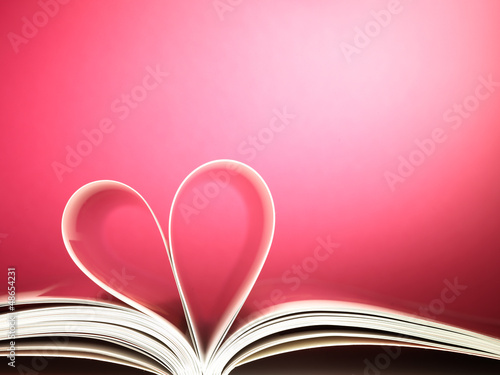 pages of a book curved into a heart shape